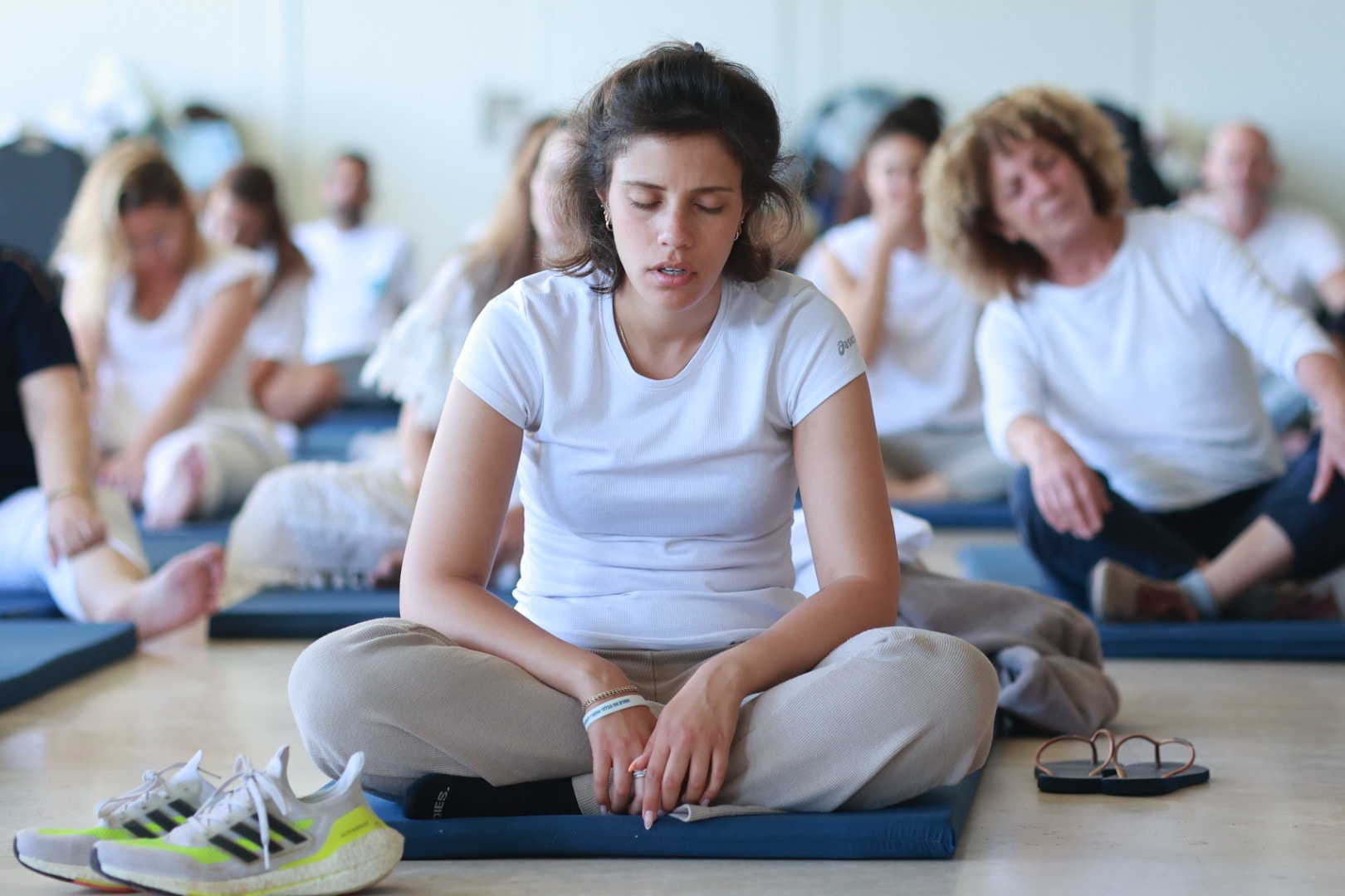 "Participants engaging in morning meditation at Tao Rehab Thailand in a peaceful outdoor setting."